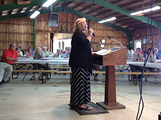 Bonnie leading worship for Sunday morning service at Pier-Lon campground.